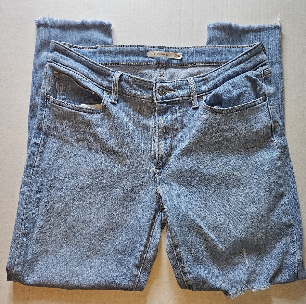 Levi's 711 Mid Rise Light Blue Ripped Skinny Jeans